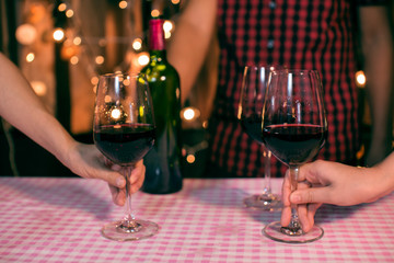Waitress man pouring wine into glass