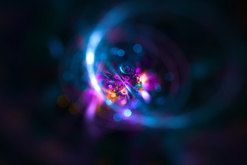 Abstract colorful light elements on dark background. 