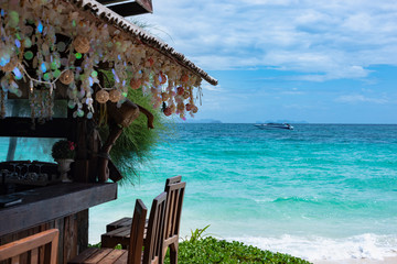 authentic beach bar with a large selection of alcohol on a tropical island in andaman sea. Mai Thon island. Thailand