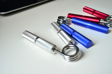 Expanders of different colors depending on the load with or without a hand. Sports and physical activity