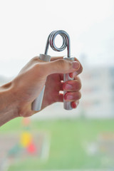 Expanders of different colors depending on the load with or without a hand. Sports and physical activity