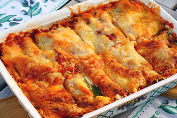 Dish of zucchini lasagna smothered with cheese