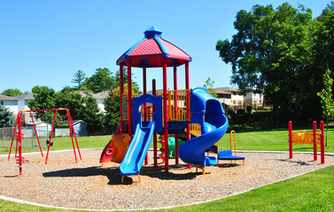 Colorful playground with swings and slides in a park for children