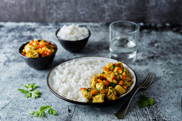Curry chicken with rice in a plate