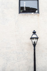 street lamp in front of wall