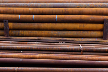 metal pipes with rusty streaks, taken on a cloudy day