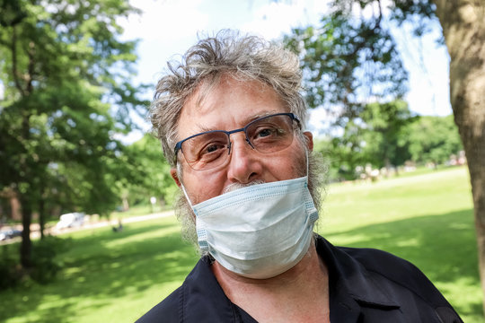 Man Wearing Mask Incorrectly Under His Nose Outdoors In Public