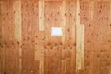Plywood wall with note masking taped note paper