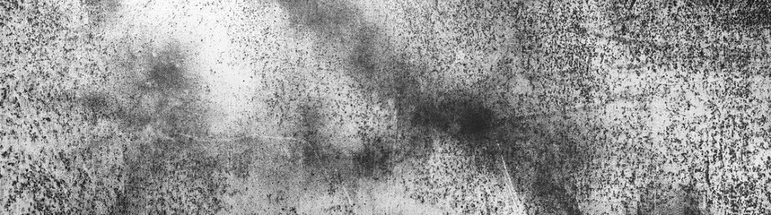 Empty black and white corrosion and oxidized background, panorama, banner. Grunge rusted metal texture. Worn metallic iron wall.