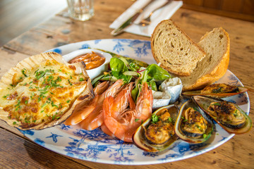 Fresh seafood platter prawns mussels chowder sharing meal