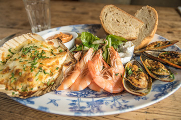 Fresh seafood platter prawns mussels chowder sharing meal