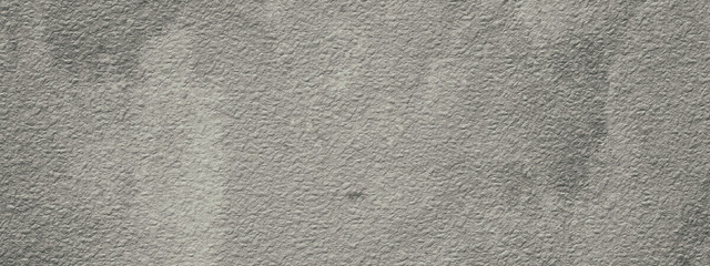 Abstract grey gypsum wall, background - in the form of a rough embossed gypsum surface, closeup