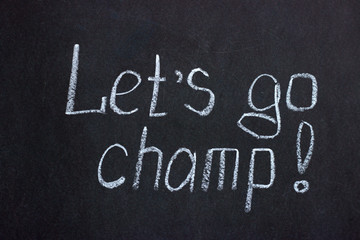
The inscription on the chalkboard "let's go, champ". Motivating phrase