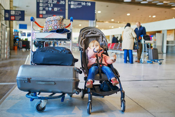 Adorable little toddler girl in international airport