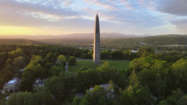 Aerial 4K video of Bennington Monument obelisk at sunset. Filmed in Bennington, Vermont.