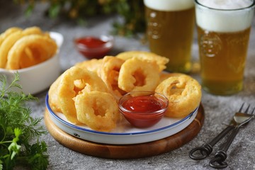Deep fried onion rings in beer dough. Homemade fast food.
