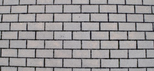 An aerial view of a fragment of a paving stone pavement.