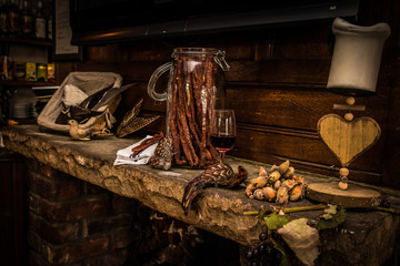 Dried cured meat on stone mantelpiece 