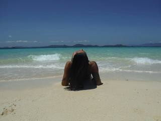 Fototapeta na wymiar Tanned woman bikini beach paradise 