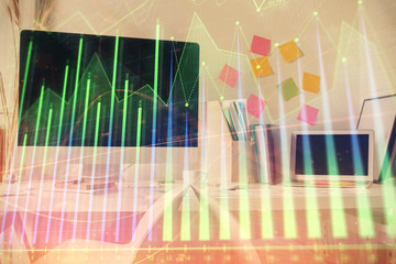 Double exposure of financial graph drawing and office interior background. Concept of stock market.