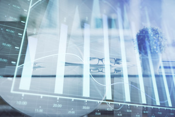 Double exposure of financial graph drawing and office interior background. Concept of stock market.