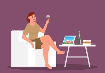Woman looking at the tablet with nature view and drink glass wine.