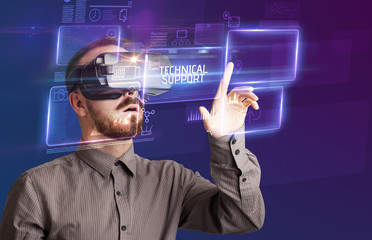 Businessman looking through Virtual Reality glasses with TECHNICAL SUPPORT inscription, new technology concept