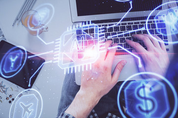 Multi exposure of man's hands typing over computer keyboard and data theme hologram drawing. Top view. Technology concept.
