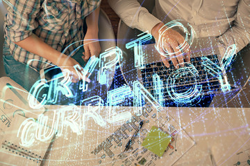 Double exposure of man and woman working together and crypto theme hologram drawing. Computer background. Blockchain concept. Top View.