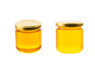 jar of organic honey isolated on white background. full jar of honey.