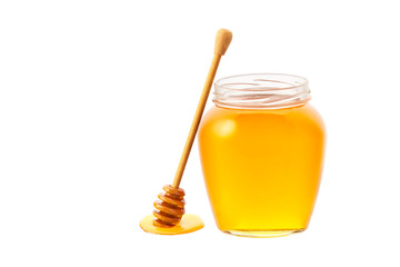 jar full of fresh honey. glass jar of  honey isolated on white background.