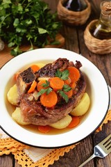 Braised beef with onions and carrots with boiled potatoes.