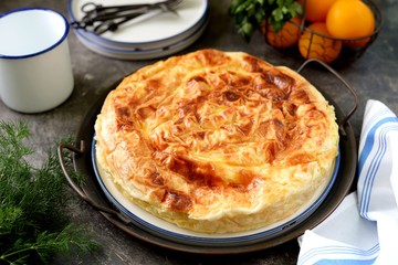 Traditional Balkan filo pastry pie with cottage cheese, sheep’s cheese and yogurt mixed with chicken eggs. Organic healthy food.