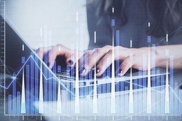 Double exposure of woman hands typing on computer and forex chart hologram drawing. Stock market invest concept.