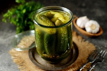 Homemade salted cucumbers with onions, garlic, dill, vinegar and green pepper. 