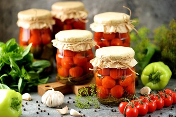 Homemade pickled cherry tomatoes with dill and garlic.