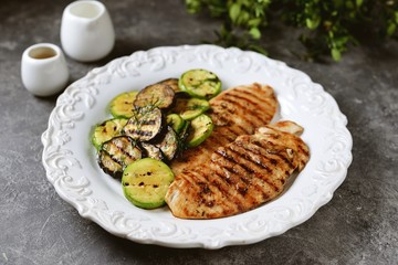 Grilled chicken breast, courgettes and eggplants marinated with olive oil, garlic and soy sauce. Healthly food.