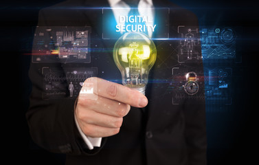 Fototapeta na wymiar Businessman holding lightbulb with DIGITAL SECURITY inscription, online security idea concept