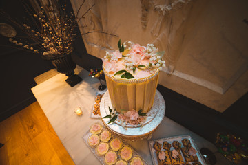 Tall Rustic Wedding Cake with Flower Decorations