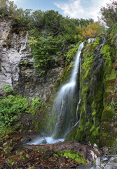 Fototapeta na wymiar A waterfall no one has visited but me cascades down the side of mount timpanogos in Utah.
