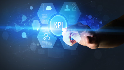 Hand touching KPI inscription, new technology concept