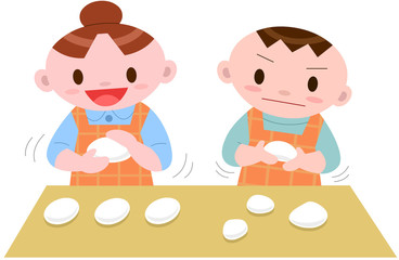 餅つきイベントでお餅を丸める子供