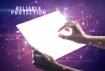 Holding futuristic tablet with RELIABLE PROTECTION inscription, cyber security concept
