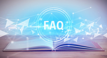 Open book with FAQ abbreviation, modern technology concept