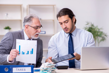 Two accountants working in the office
