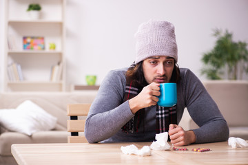 Young man suffering at home