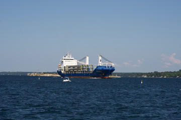 A large carrier boat on a river
