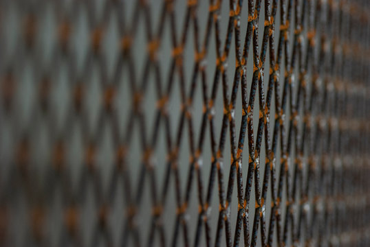 Background image of a rusty iron grating