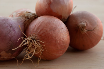 Onions on the wooden floor.