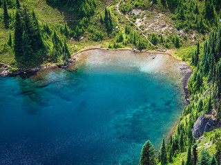 Naklejka na ściany i meble Clear blue alpine lake in Mount Rainier National Park